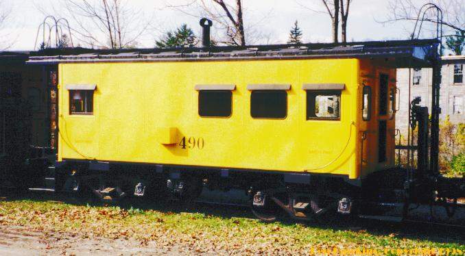 Photo of Maine Central caboose #490 at Tilton, NH.
