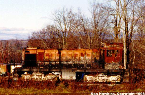 Photo of A burnt WACR Alco sits by the Bombardier facility in Lower Websterville, VT.