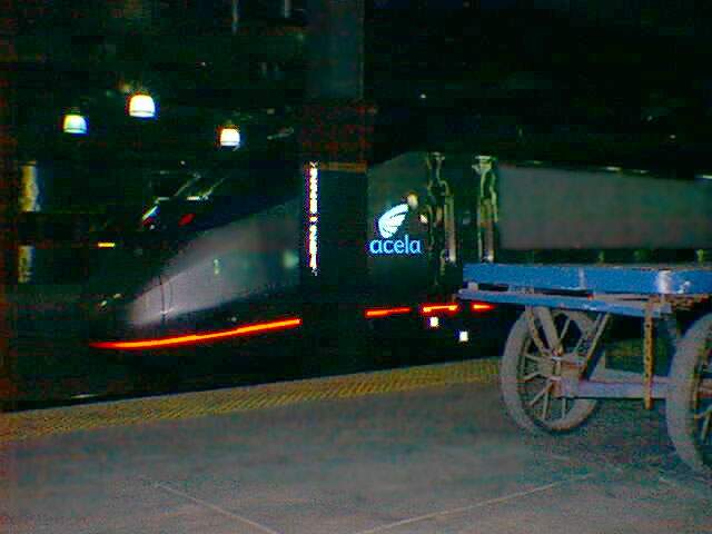 Photo of Acela Express #958.  Old meets new.