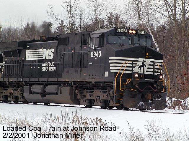 Photo of NS 8943 on the lead of a loaded coal train