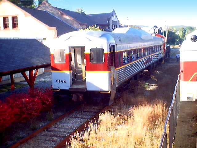 Photo of Two trains pass at historic Plymouth NH station