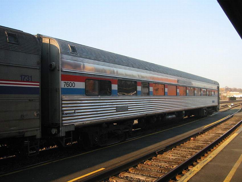 Photo of Amtrak Coach 7600 on the rear of a mail train