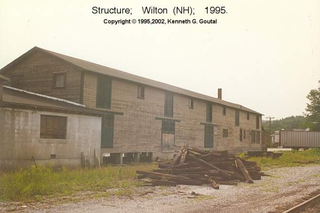 Photo of One of several buildings trackside in Wilton (NH), Summer, 1995.