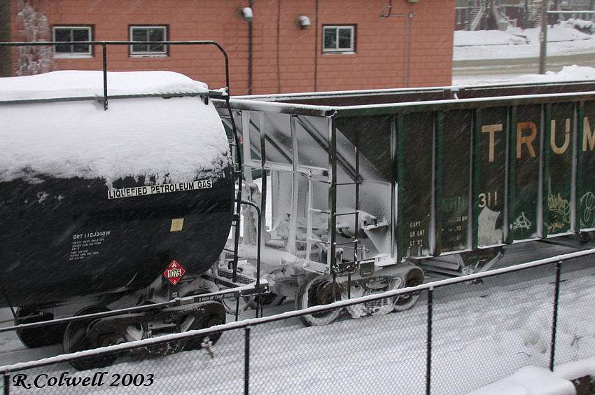 Photo of NHN closeup of 5th and 6th cars of consist with snow buildup