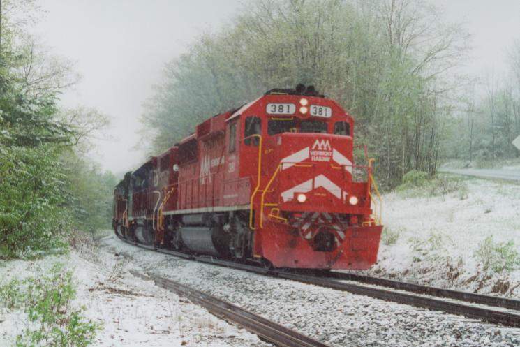Photo of GP60's #381 & 382 on T#263 battle a late spring snowstorm.