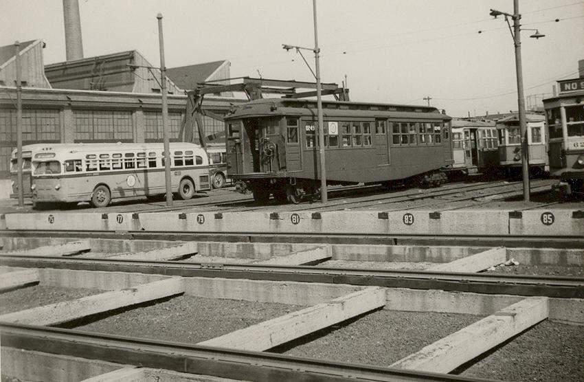 Photo of Car 0249 in the yard & a couple of MTA busses