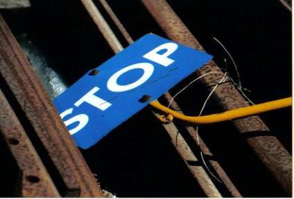 Photo of Stop Sign tangled in Maine Coast siding Rockland Yard