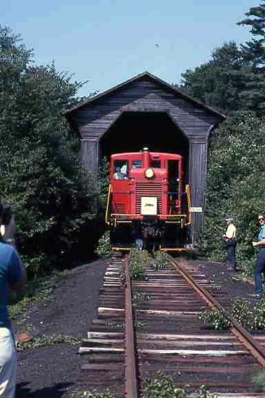 Photo of Claremont & Concord #31 emerging from the covered bridge.