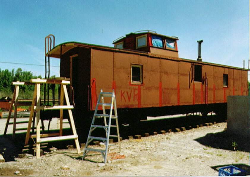 Photo of Model RR club refurbishing BAR caboose