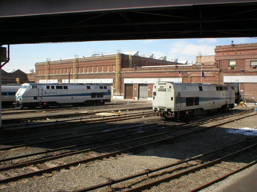 Photo of MTA Genesis locos 226 and 208 bask in the sun at Croton Harmon facility.