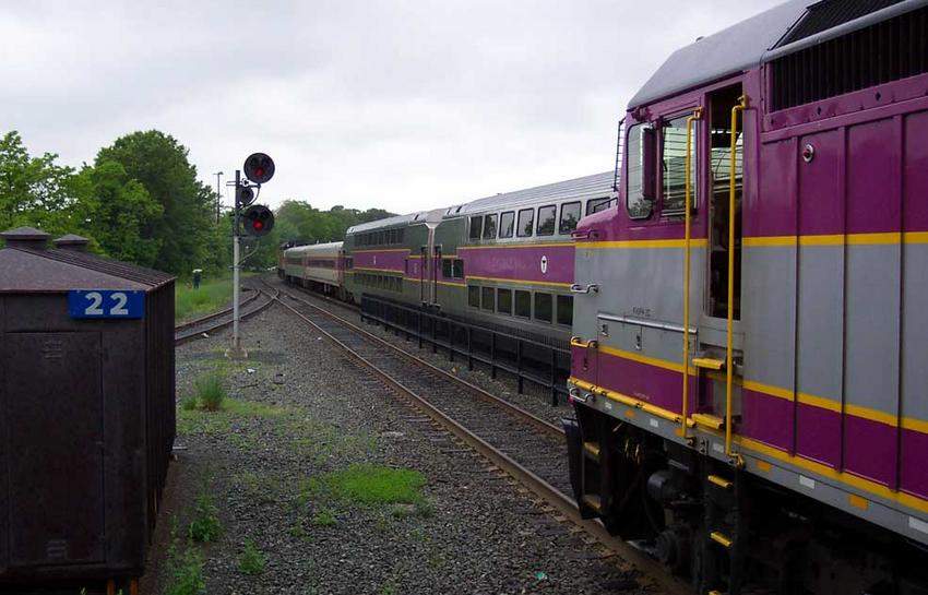 Photo of P561 departs Framingham as P558 looks on