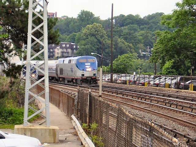 Photo of Amtrak passing Metro North.