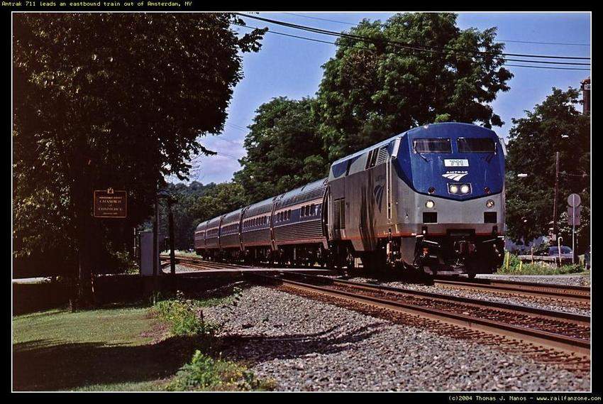 Photo of Amtrak 711 leading an eastbound out of Amsterdam, NY