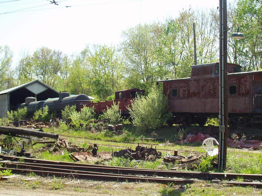 Photo of cars in front of the restoration shop and north car barn