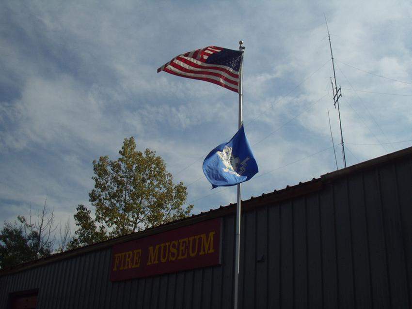 Photo of flag in front of fire museum