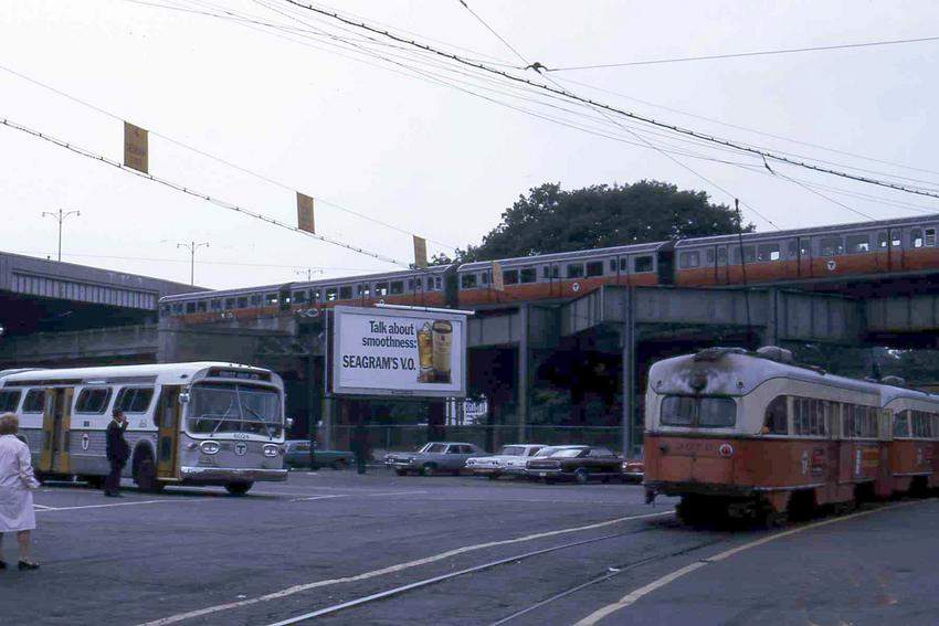 Photo of Forest Hills in 1970 shows Bus, Trolley,  Elevated Train