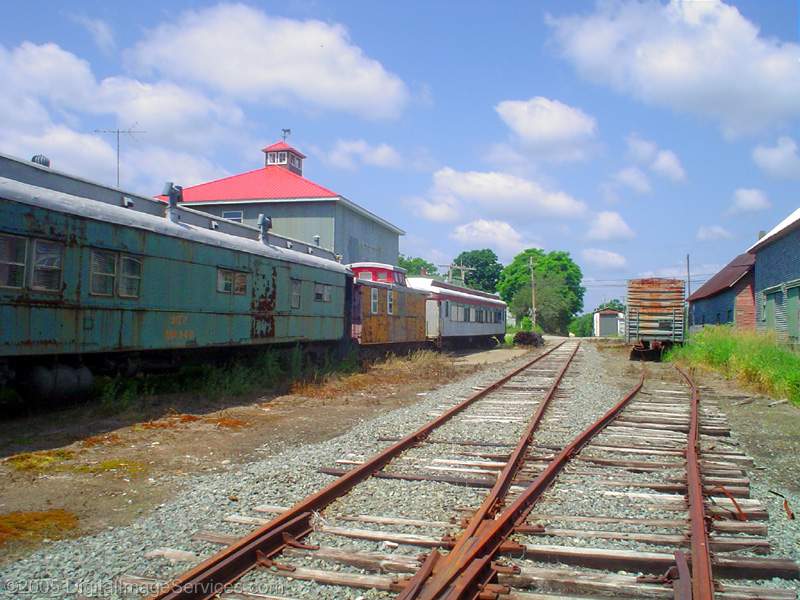 Photo of Retired ex-MEC MoW cars in the B&MLRR yard at Thorndike, ME