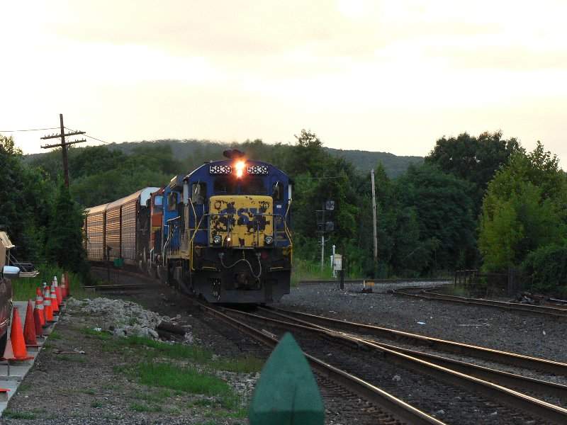 Photo of a CSX train with  on the way through Plamer Mass.