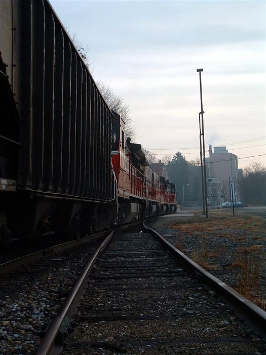 Photo of PW empty Johnson City NY coal extra stops at Bridge St in Willimantic CT