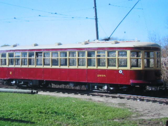 Photo of Trolley sitting of to the side on a siding