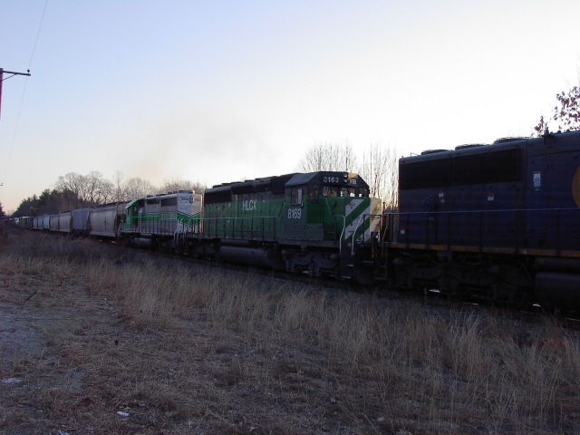 Photo of HLCX 8169 on an earliy morning CSX train