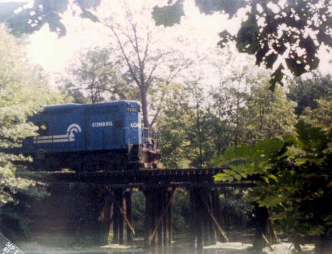 Photo of Ex-New Haven GP-9 crawls across Taunton River trestle on the Dean Street Branch