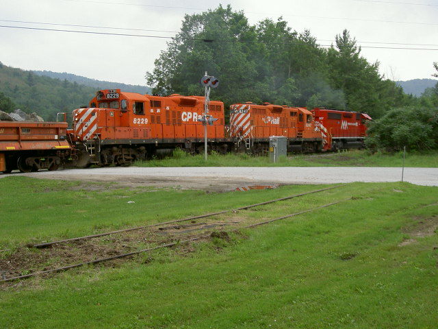 Photo of Green Mountrain Railroad Stone Xtra at Cuttingsville, Vt  crossing 07-02-06