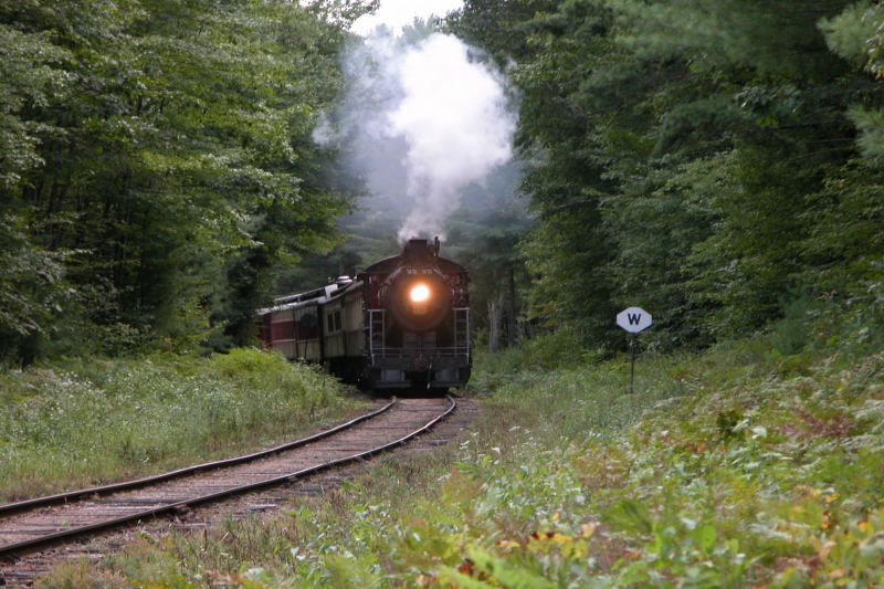 Photo of CSRR 7470 with consist approaches a grade crossing on West Side Rd.