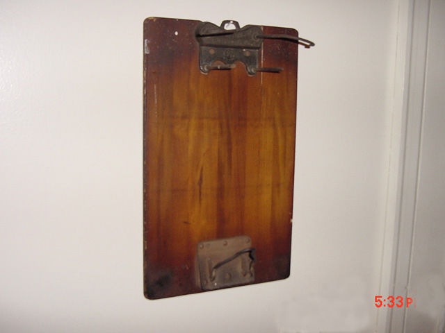 Photo of NYNHHRR-Bulletin Clipboard with hole punch.