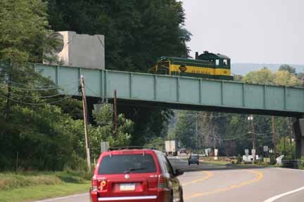 Photo of Lycoming Valley RR pushing cars up hill over U.S.rt 11