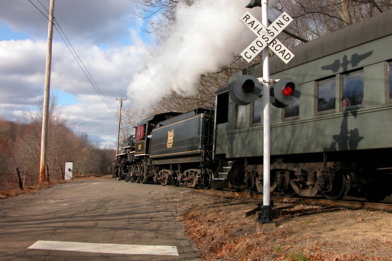 Photo of Valley Railroad #97 crosses a country road in Essex, CT