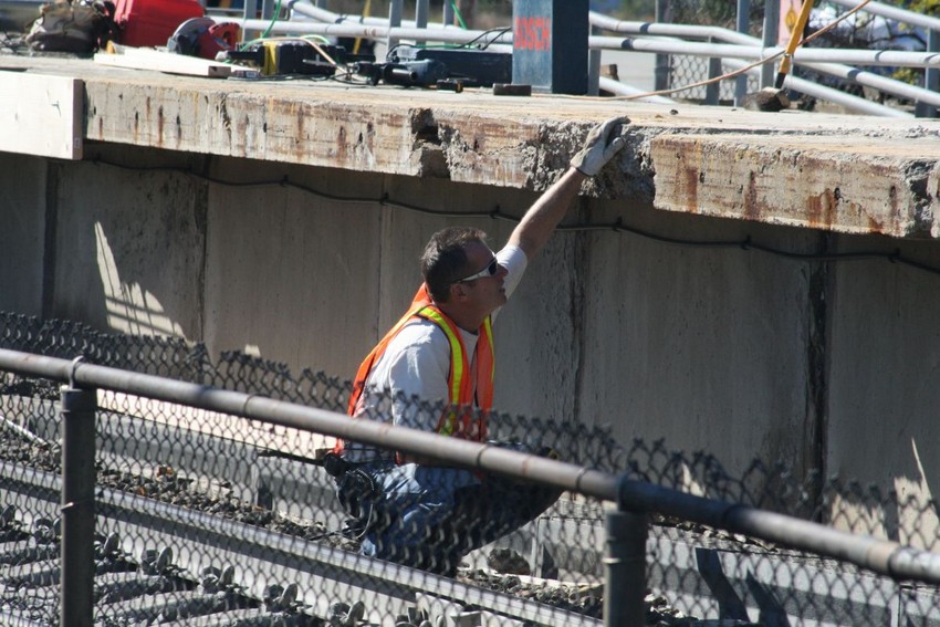 Photo of Amtrak at work repairing the Mansfield Depot platforms
