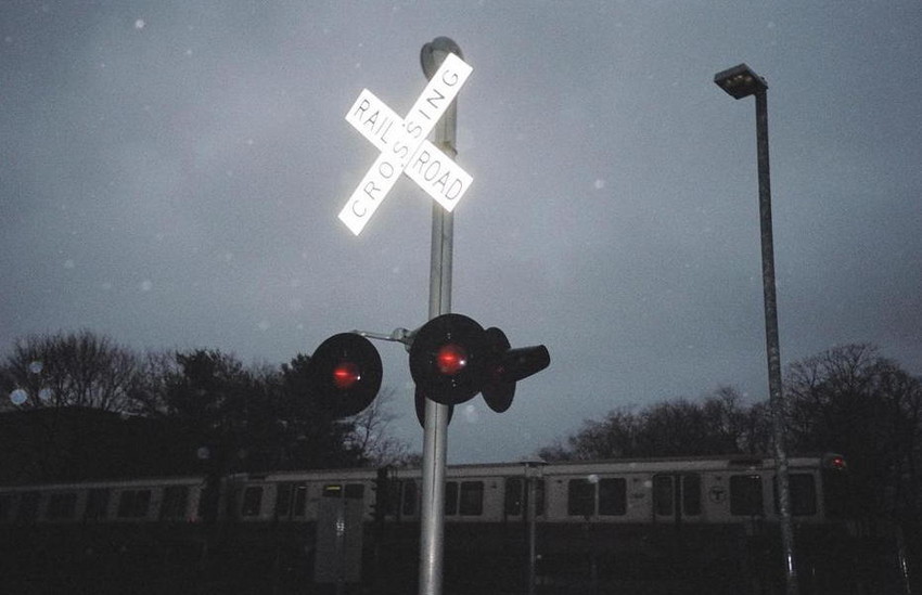 Photo of crossing lights on a dark rainy day