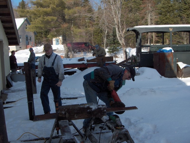 Photo of outdoor crew working on #9's frame