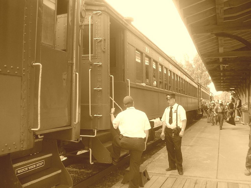 Photo of Train crew discusses railroad business...