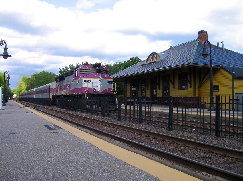 Photo of GP40MC 1130 pushes its train inbound past the station at West Concord