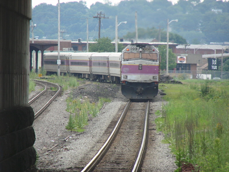 Photo of F40 1002 pushes train thru old abandoned Lawrence Station