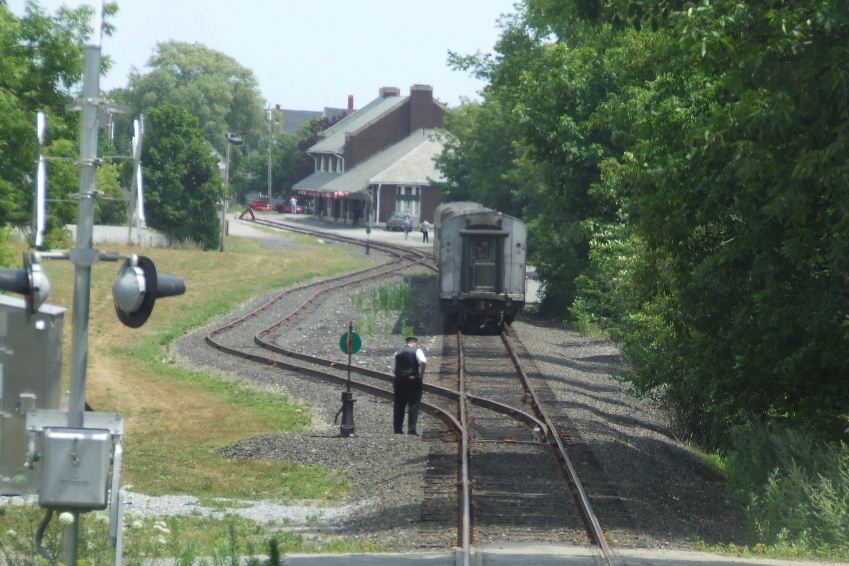 Photo of Conductor Henry throw switch and walk to train.
