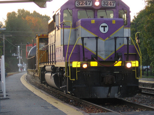 Photo of MBTX 30, the new rail washer, slowly passing west through Concord, MA.