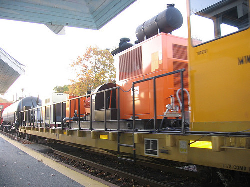 Photo of MBTX 30, the new rail washer, slowly passing west through Concord, MA.