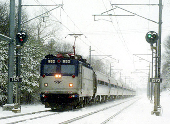 Photo of Amtrak northbound in snow at Kingston...