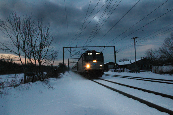 Photo of At Dusk, northbound Amtrak Regional approaches  Wolf Rocks, RI