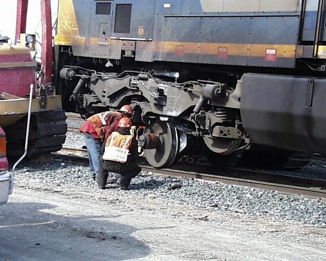 Photo of rj corman chanching a wheel out on a ac60w at east yard at pittsfield ma