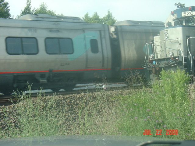Photo of Acela passing work train