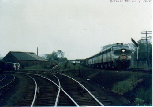 Photo of new haven yard at pittsfield ma and a new yorkcentral train passing by