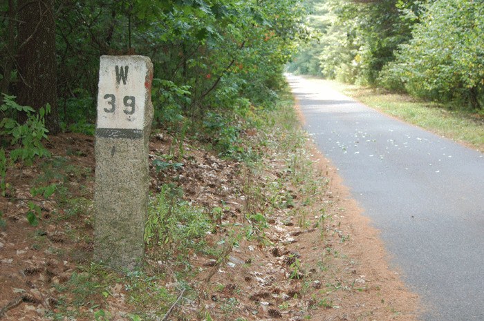 Photo of mile post on the Ayer to Nashua rail trail