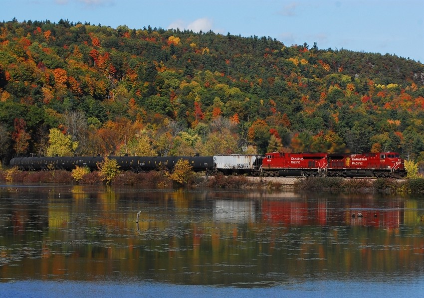 Photo of CP 666-020 train Rivals nearby foliage