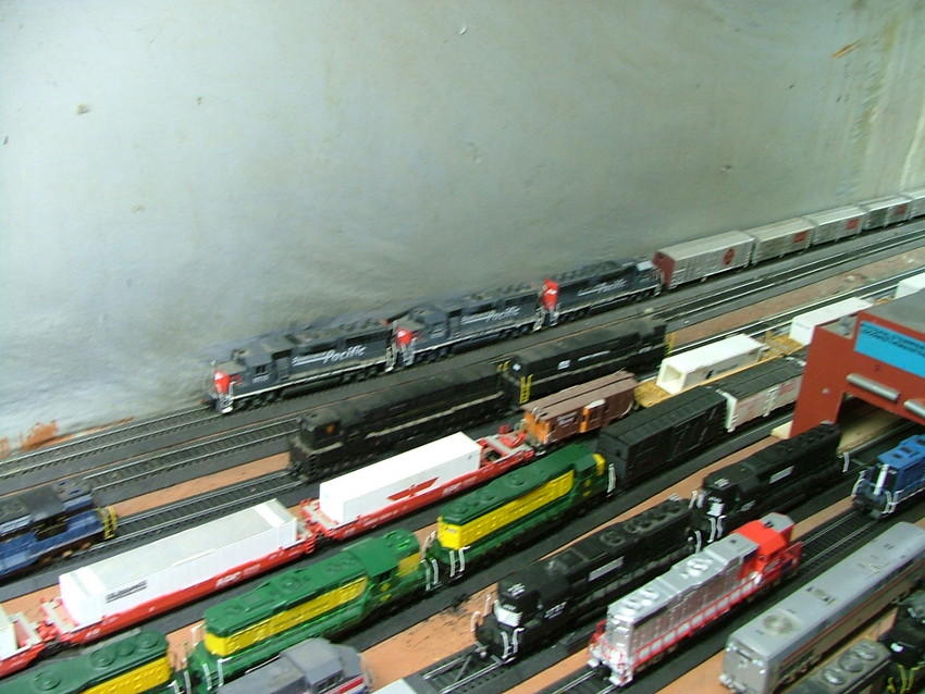 Photo of three southern pacific gp60's pulling a 45 car train on my layout