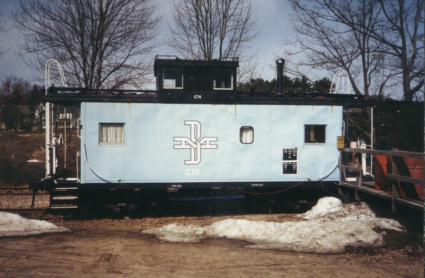 Photo of Boston & Maine caboose C76 in repose