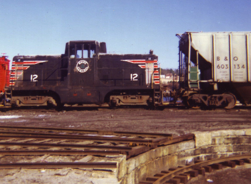 Photo of MEC#12, a GE 44-Ton yard switcher, at the BML main yard in Belfast